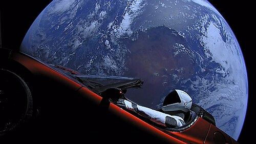 Tesla Roadster with spacesuited mannequin drifting in space